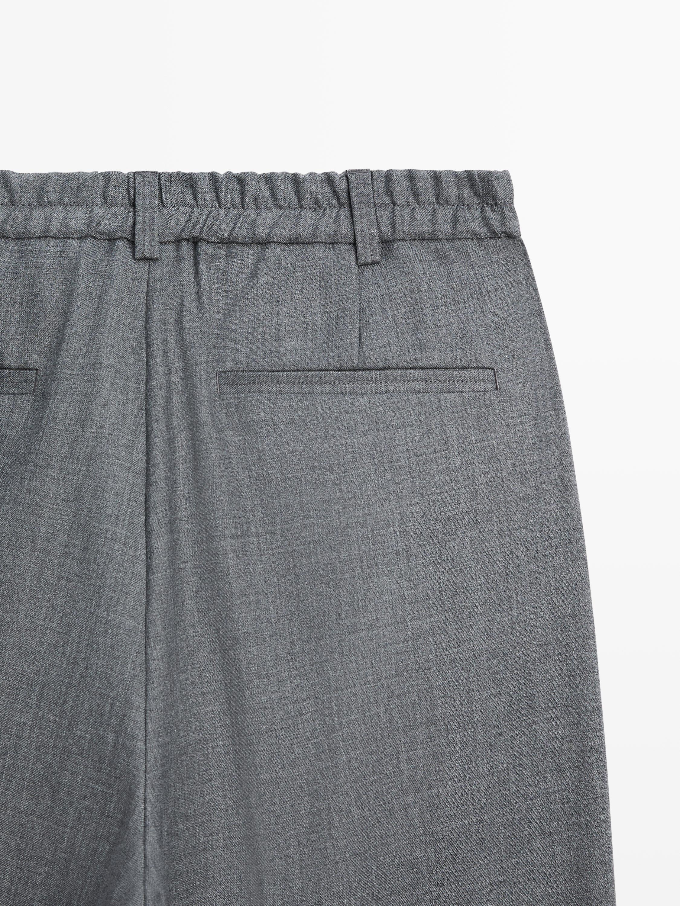 Pantalon relaxed fit à pinces en laine froide